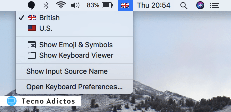 Para cambiar la distribución del teclado, haga clic en el ícono de la pequeña bandera en su Mac's barra de menú. 