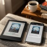 Kindle y smartphone sobre manta con café y libros desenfocados